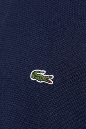 Lacoste Polo bear graphic to centre-chest with spray paint print throughout