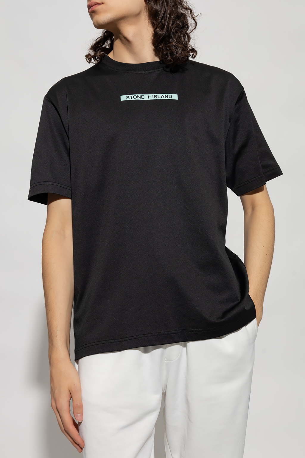 Stone Island Black V-neck T-shirt from featuring embroidered brands logo