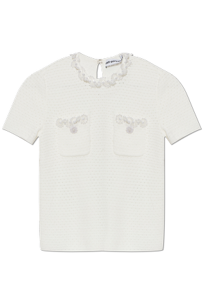 Top with shimmering appliqués