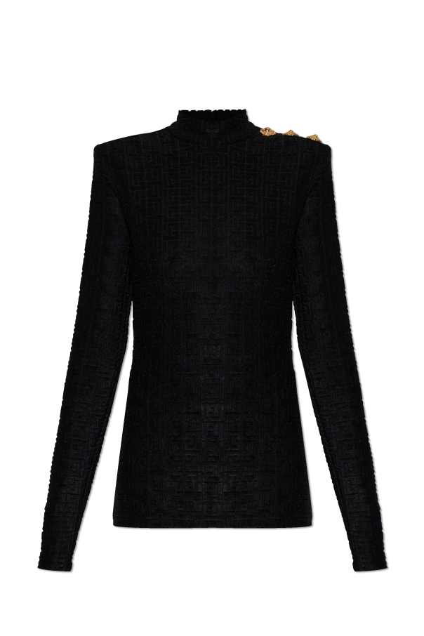 Top with decorative buttons on the shoulder od Balmain