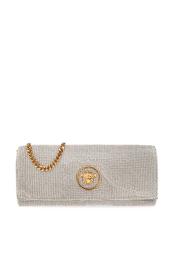 Clutch bag with shimmering crystals od Versace