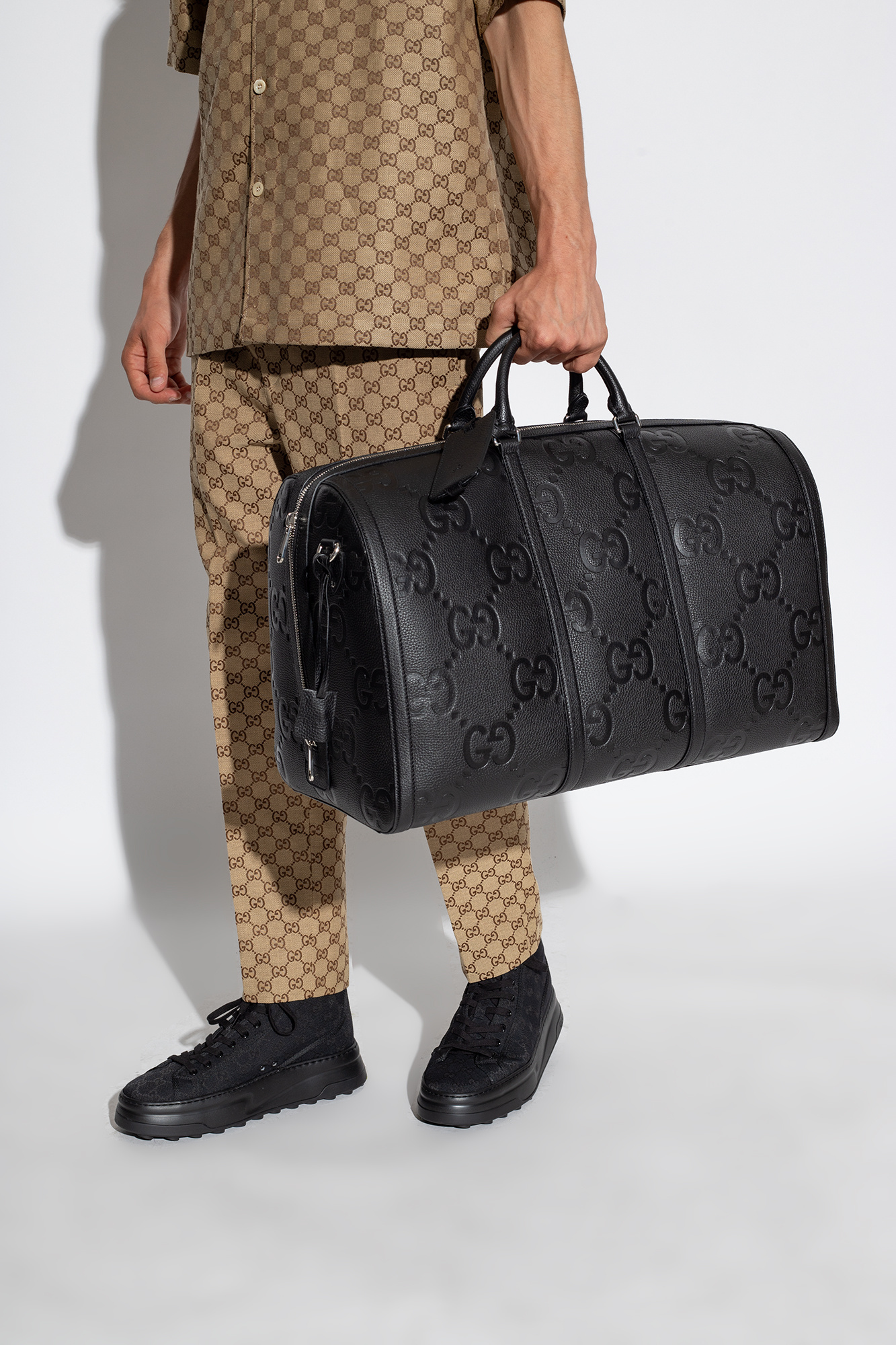 GG Embossed Leather Duffel Bag in Black - Gucci