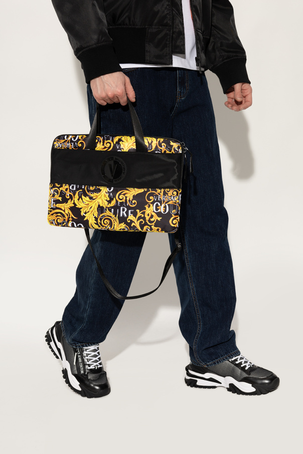 Versace Tapered-Max Jeans Couture Briefcase with ‘Logo Couture’ print