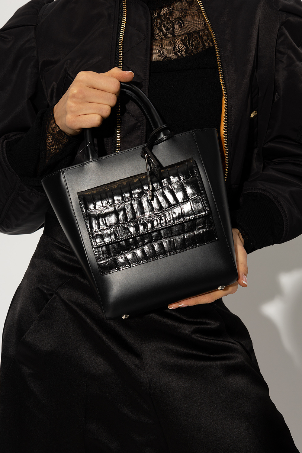 Undercover CC turn-lock chain tote