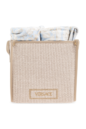 Set of four towels with basket