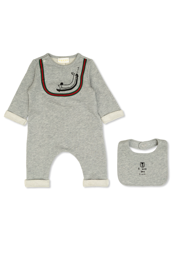 Set: baby sleepsuit and bib od Gucci Kids